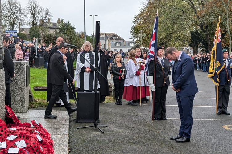 Ben Maguire MP bows his head after laying a wreath at the memorial in Bodmin's Priory Park. (Picture: Aaron Greenaway/Tindle)