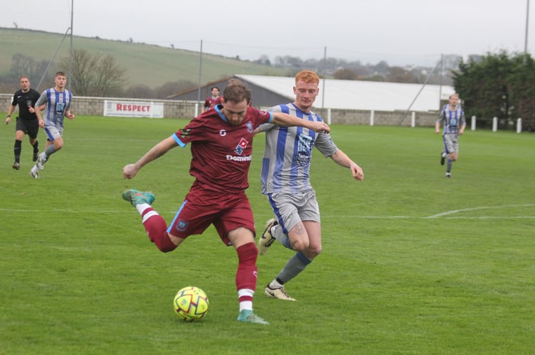 Lucas Preston takes an early shot for the Clarets as Ollie Moores looks to get back. Picture: Paul Hamlyn