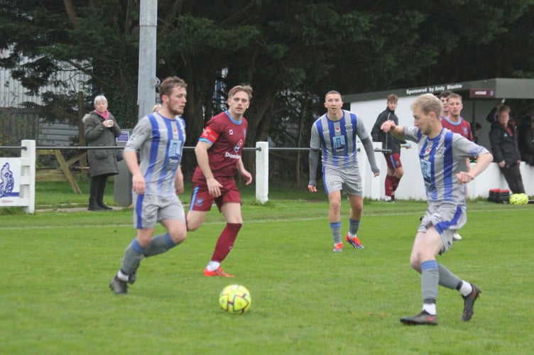 Holsworthy duo Cory Sargent (left) and Jake Cartwright go for the ball as Launceston skipper Mike Steele looks on. Picture: Paul Hamlyn