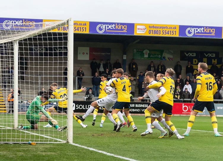 A scramble in the Torquay United box moments before Truro thought they had gone in front through skipper Connor Riley-Lowe. Picture: Colin Bradbury
