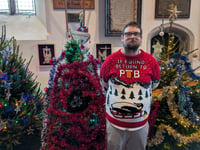 Medieval church transformed into sparkling Christmas tree wonderland