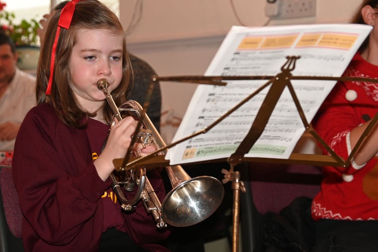 Willow of the St Breward Junior band plays some festive carols on her cornet (Picture: Adrian Jasper)
