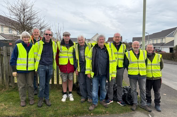 Pictured from left to right are: Ros Wardle, Rob Hore, Tim Watson, Colin Maxey, Alastair Clements, Keith Picot, Matthew Wintrip, Trevor Dawson and Keith Wilton. Also helping, but not pictured were: Ray Fursdon, Julia Foster, Andy & Wendy Walker, Roy & Lorna Wiffen. (Picture: Holsworthy Hamlets Parish Council)