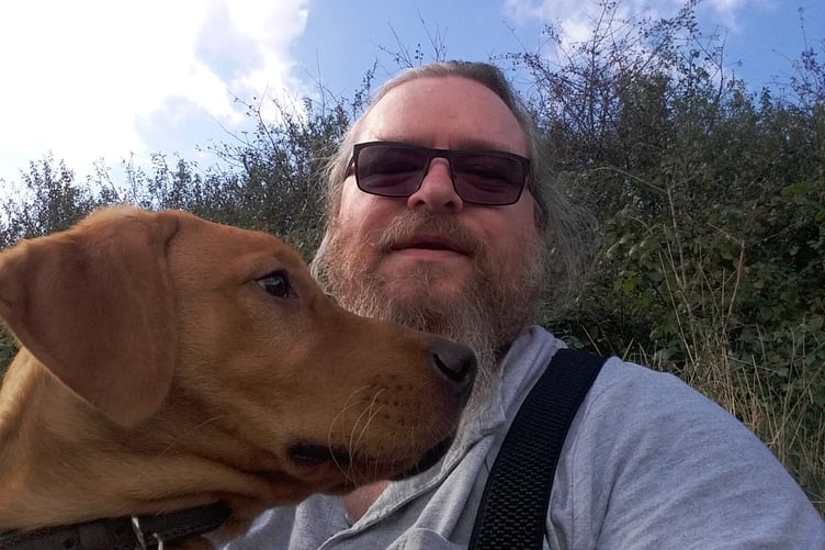 Russell Fleming with his support dog, Buster. (Picture: Russell Fleming/The ME Association)