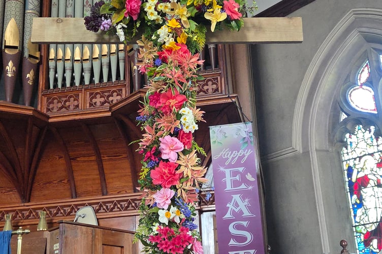Members and friends of Holsworthy Methodist Church brought posies and processed to the front of the church to have their flowers placed on the Cross