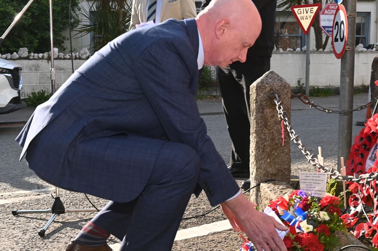 Cllr David Garrigan lays a wreath on behalf of the people of St Teath and Tintagel Division at the St Teath Clock Tower (Picture: Adrian Jasper)