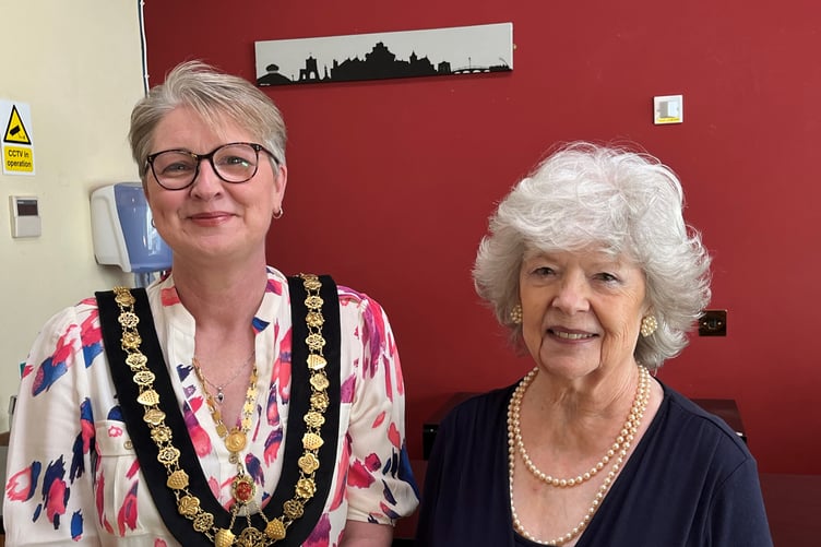 Helen Bailey and Angie Harris painting donation