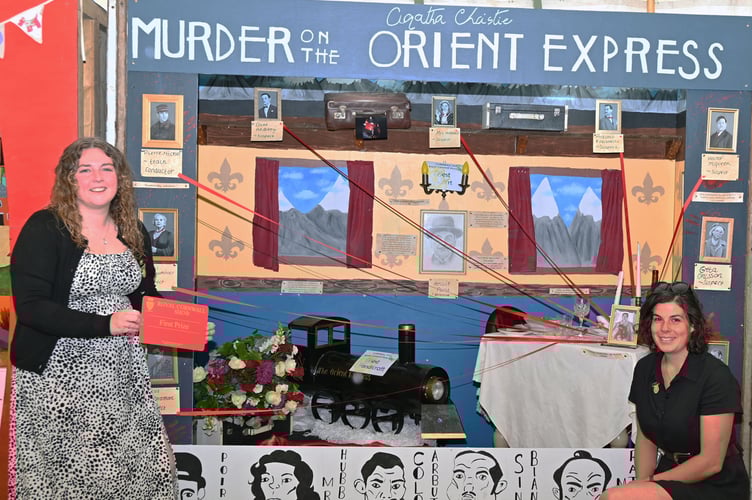 Pictured alongside Camelford Young Farmers' Club's winning cubicle, themed on Agatha Christie's 'Murder on the Orient Express' are Marley Lamerton (general purpose vice chairman) and Beth Well (vice chairman)