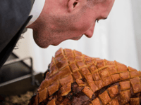 Groom's hog roast challenge at wedding