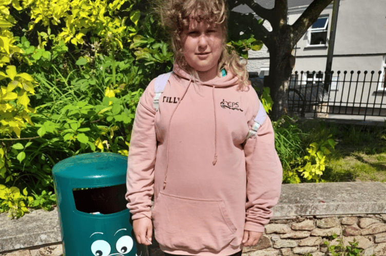 Callington scout Tilly Hare stood beside her design on the town's new smiley recycling bins. (Picture: 1st Callington Scouts)