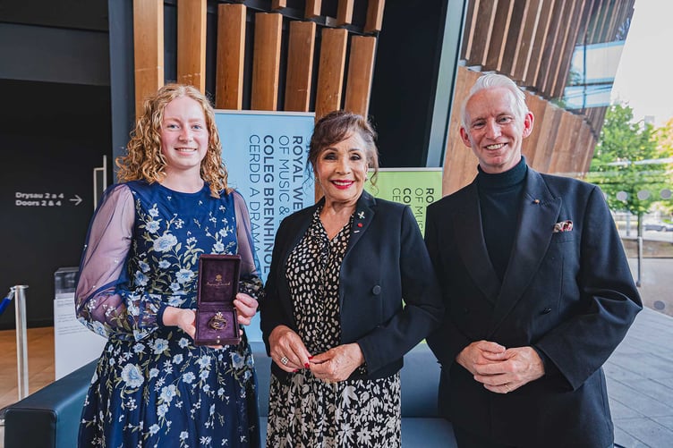 Tamar Valley's Bethany Coggon, first ever recipient of the Royal Welsh College Brooch for Harp Excellence presented by Dame Shirley Bassey and the King's representative Dr Grahame Clive Davies.