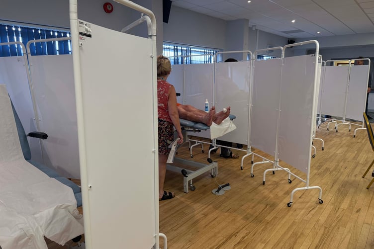 Examination bays were set up in a community hall by the NHS.