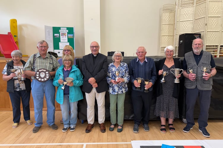 The cup winners of Halwill Flower & Produce Show, left to right, Doreen Bray, Peter Williams, Anji Hall (with Eleanor Williams stood in front of her,) Rev. Dr Paul Fitzpatrick, Pat Smallacombe, Brian Wonnacott, Betty Darke & Chris Towell (David Trout)