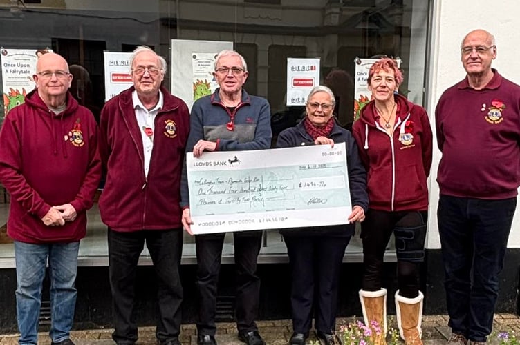 Members of the Callington Lions club hand over a cheque to Jeremy and June from the Callington Team of the Plymouth Soup Run