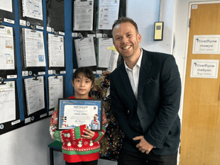 MP presents Christmas card prize to competition winner