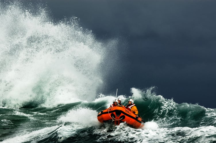 The St Ives D class Colin Bramley Parker D-668 works in tricky conditions inshore off Carn Everis at the eastern end of Porthmeor beach.Shot for Nigel Millard's book the Lifeboat: Courage on our Coasts page 179.