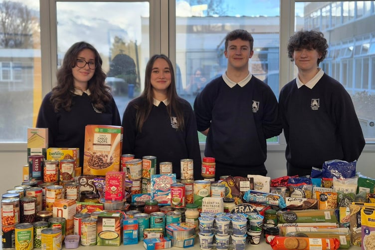 Launceston College house captains with the foodbank donations