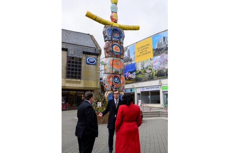 MP Noah Law shown in front of the artwork in the centre of St Austell. (Picture: Jake Bonetta)