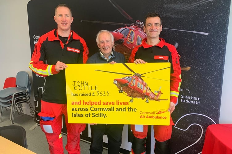 Representatives of Cornwall Air Ambulance were presented with the amount by John Cottle. (Picture: John Cottle)