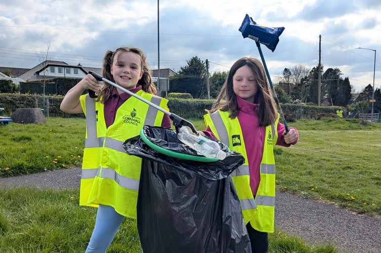 Two of the youngsters in Callington who aided the local Lions club in helping the clean-up at the town's Recreational Park (Picture: Callington Lions Club)