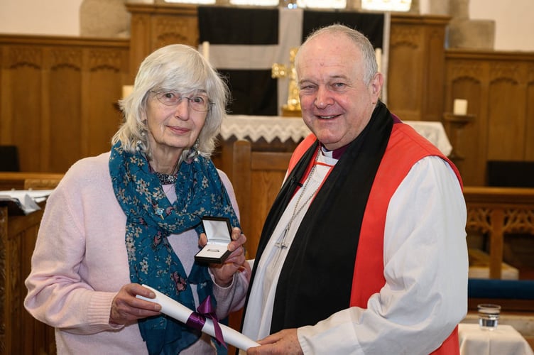 Sandy Cheshire receiving her St Piran award from the Rt Rev David Williams, Bishop of truro