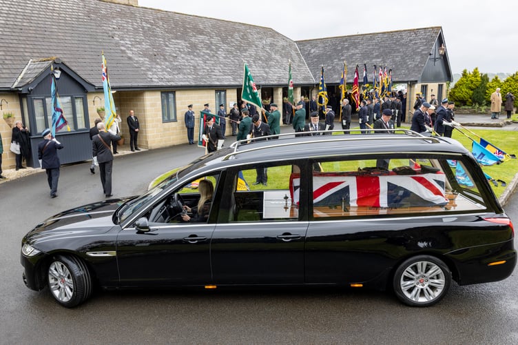 Image shows the hearse arriving.Royal Air Force St Mawgan today joined the wider community in paying tribute toAlfred âBarneyâ Barnett, a distinguished Second World War RAF veteran, whosefuneral took place at Glynn Valley Crematorium, Bodmin at 1130 hrs.Aged 104, Barney lived an extraordinary life of service. Enlisting in 1941 as an AirGunner and later commissioned in 1943, he flew 80 combat sorties over Germanyduring the Second World War. He went on to serve with the elite Pathfinder Force,responsible for marking targets ahead of the main bomber stream, before latertraining as a pilot.Following his commission, Barney served at RAF St Mawgan on four occasionsbetween late 1952 and early 1956, retiring from Service in mid-1959.Todayâs service, officiated by the Station Padre, Squadron Leader Colin OâDell, wasattended by a wide cross-section of the community, including serving personnel,veterans, and Royal Navy and Royal Air Force Air Cadets. Senior stationrepresentatives in attendance included Station Commander Wing CommanderGareth Elliott and Station Warrant Officer Warrant Officer Darrel Keane. The largeand diverse turnout reflected the deep respect held for Barney and his generation.In accordance with his wishes, and in the absence of surviving family, close friendsentrusted his medals and flying logbooks to RAF St Mawgan. His medals, hat and one of his logbooks were used to dress the coffin, ensuring a fitting and personaltribute. The Royal Air Force will preserve his legacy in line with these wishes.