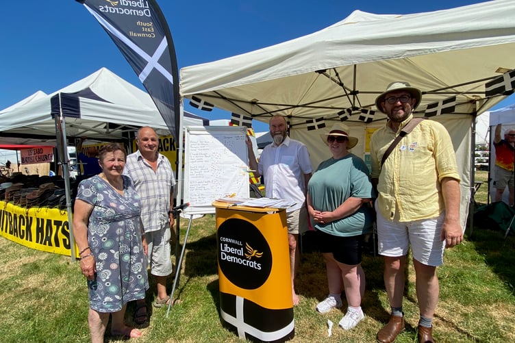 Cornwall Councillor Jim Candy (second left) alongside visitors to the Liberal Democrats stand at Liskeard Show