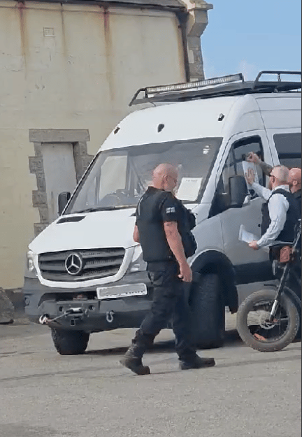 Officers working on behalf of Cornwall Council issuing eviction notices to vanlifers (Picture: Katrina Beddoe)