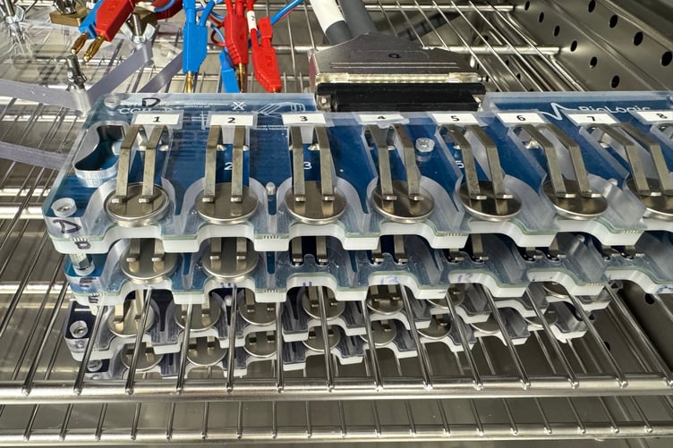 The coin cell lithium-ion batteries undergoing testing.