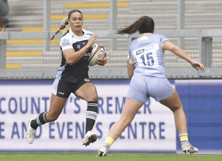 Exeter Chiefs winger Deborah Wills looks to round Leicester's Tess Feury during their clash at Sandy Park