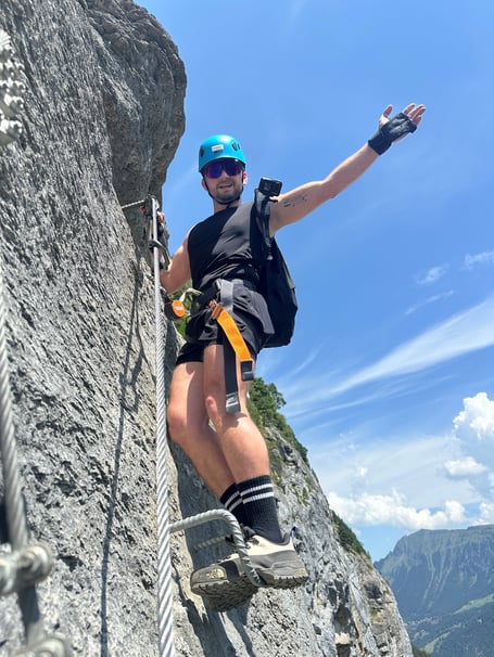 Regional director for Launceston's Kernow House care home, Cosmin Lemnaru, scaling the breathtaking heights of the Mürren Via Ferrata